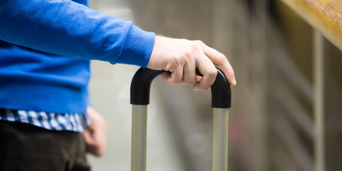 traveler-with-suitcase